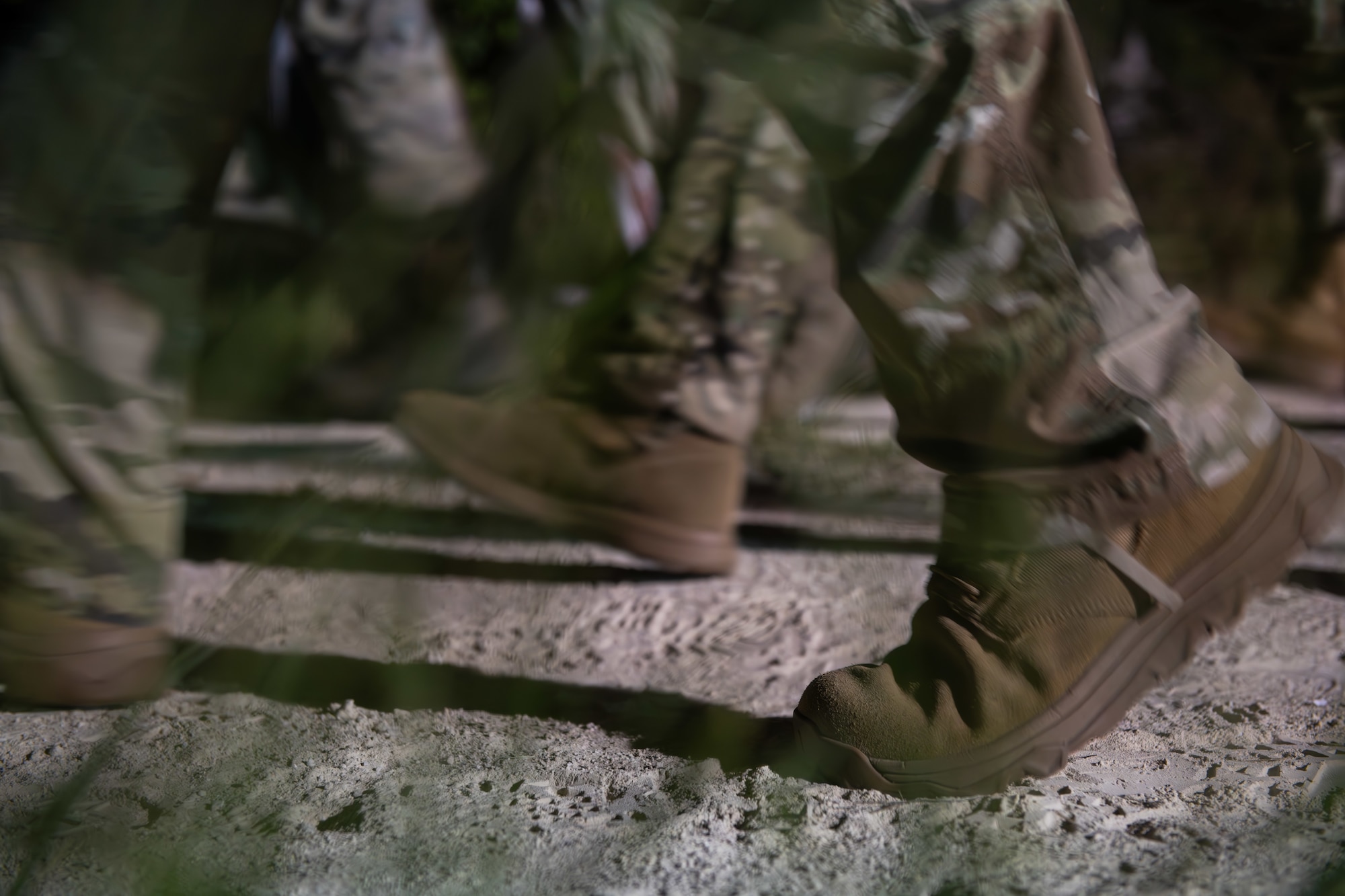 U.S. Airmen and Soldiers participate in a ruck march.