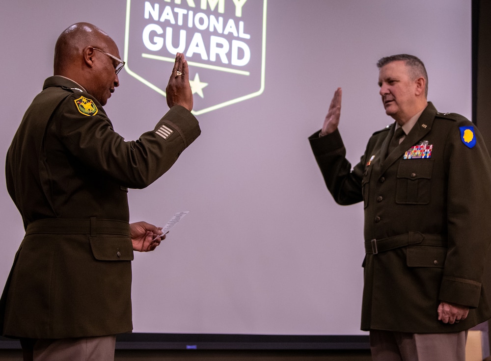 Maj. Gen. Rodney Boyd, The Adjutant General of Illinois and Commander of the Illinois National Guard, administers the oath of office to newly-promoted Brig. Gen. Lenny Williams, Assistant Adjutant General – Army and Commander of the Illinois Army National Guard, during a promotion ceremony Oct. 11 at the Illinois Military Academy, Camp Lincoln, Springfield.