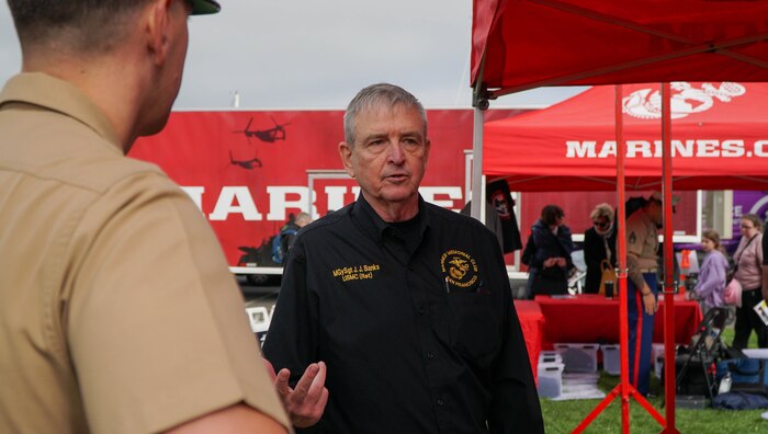 Retired U.S. Marine Corps Master Gunnery Sgt. Jonathan Banks, right, interacts with Marines with Recruiting Station San Francisco at the EXPO on the Marina Green during San Francisco Fleet Week 2024 in San Francisco, Oct. 11, 2024. SFFW, now in its 43rd iteration, is a time- honored sea service celebration that allows citizens of the Bay Area to witness today’s maritime capabilities firsthand. Nearly 2,500 Sailors, Marines, and Coast Guardsmen will showcase their capabilities and equipment, participate in various community service events, and enjoy the hospitality of the Bay Area during the event. (U.S. Marine Corps photo by Lance Cpl. Avery Wayland)