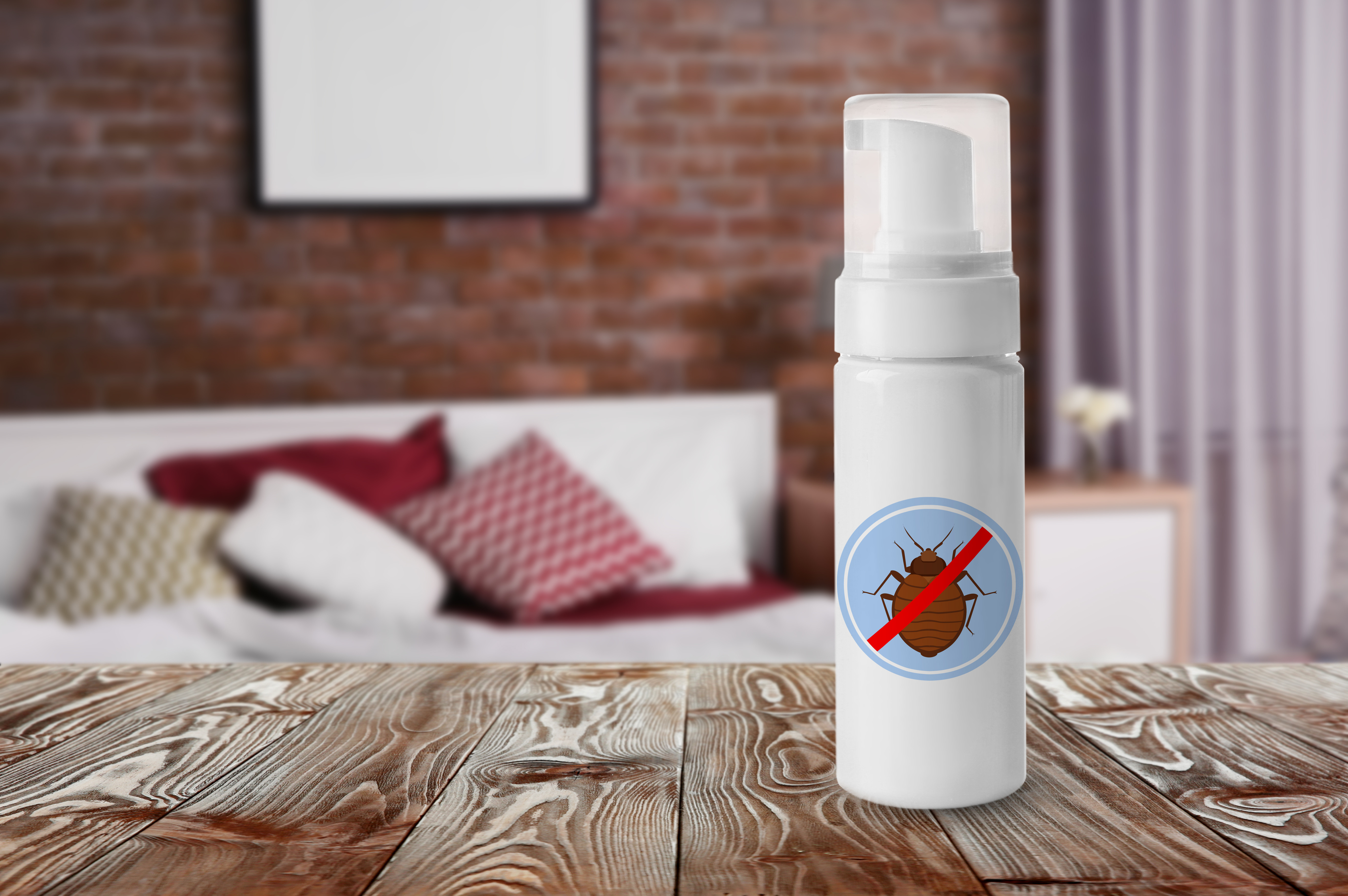 Bottle of anti bed bug detergent on table in bedroom
