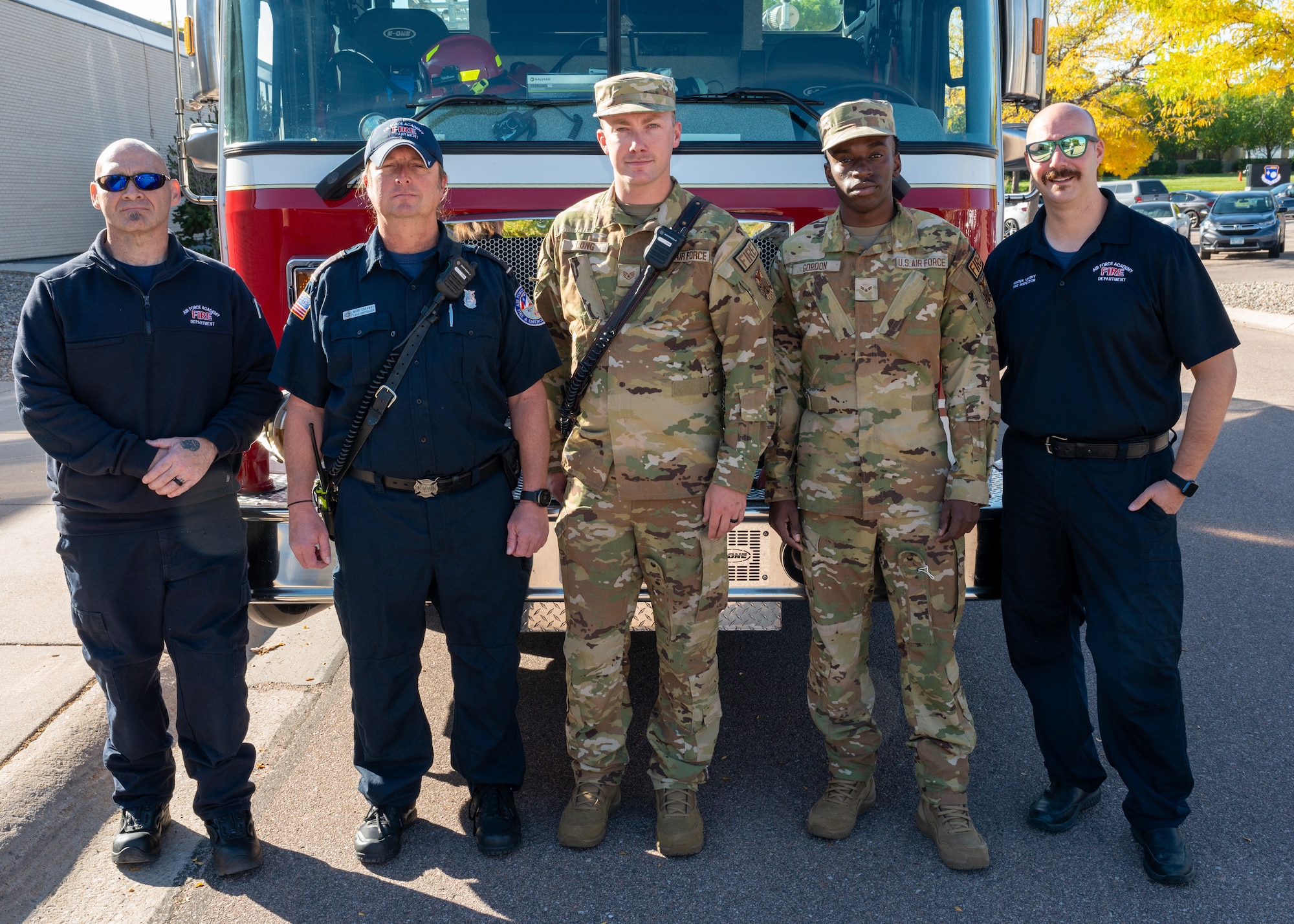 Firefighters that make up the U.S. Air Force Academy's Fire Prevention Team pause for a group photo during their facility walkthroughs at the Academy's Community Center on October 8th 2024.
