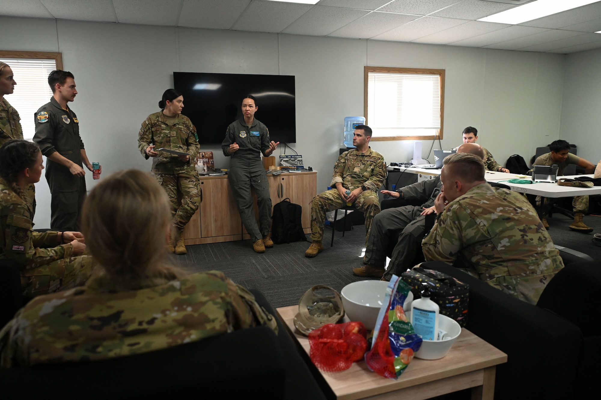 U.S. Air Force Capt. Al Hendricks, a 62d Airlift Wing exercise planner, conducts a debrief with Exercise Rainier War 25A participants to discuss improvement areas, at Kalaeloa, Hawaii, on Oct. 11, 2024.