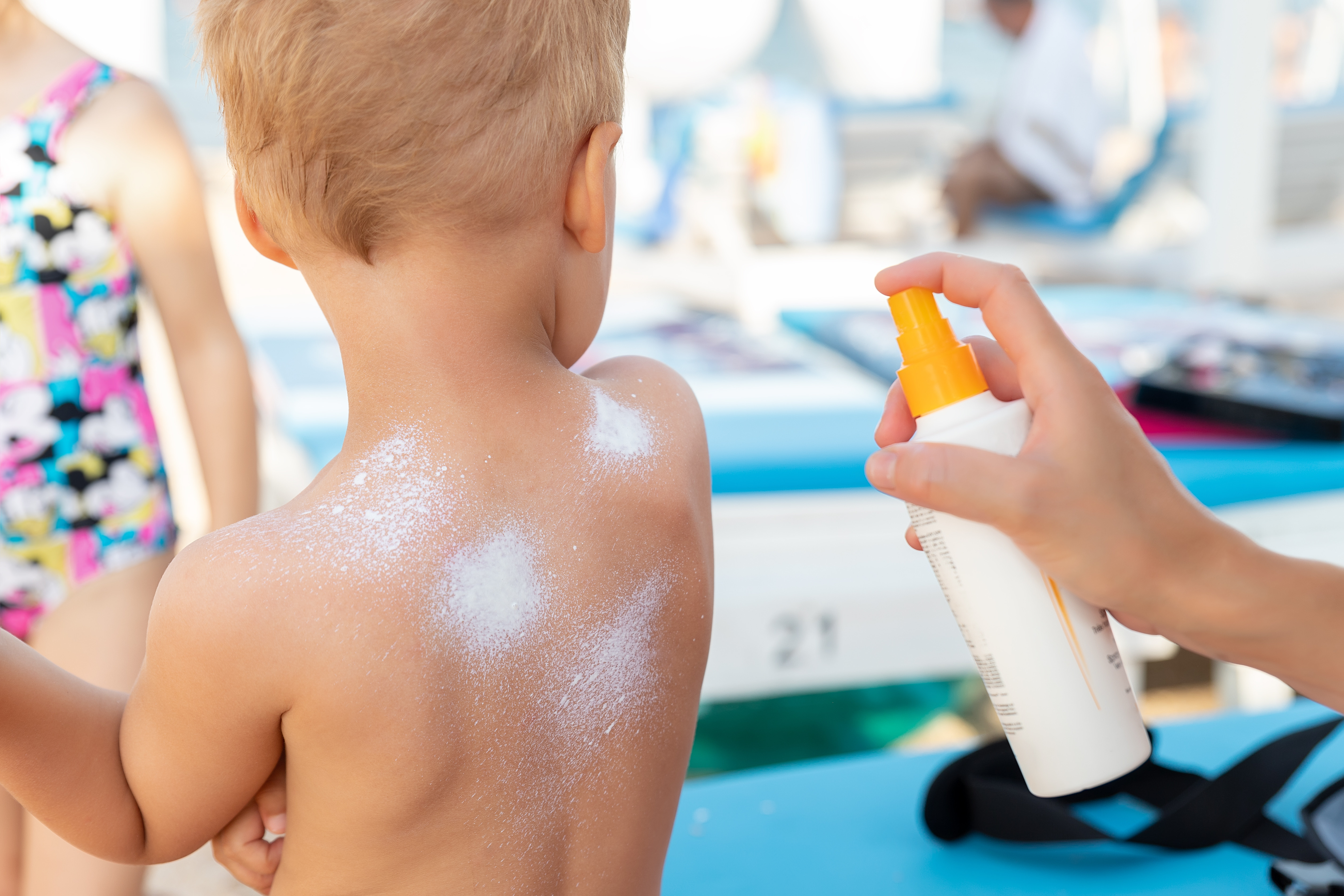 Mother Applying Sunscreen Protection Creme On Cute Little Baby B