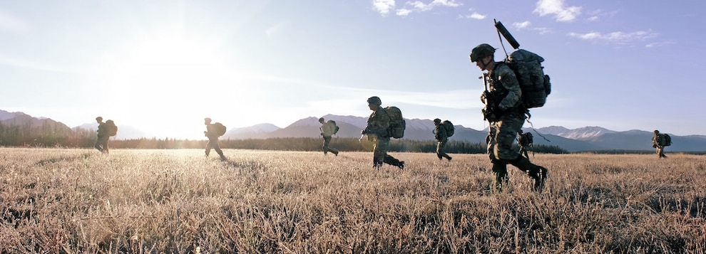 U.S. Army soldiers assigned to 2nd Infantry Brigade Combat Team (Airborne), 11th Airborne Division, moves towards their objective on Malamute Drop Zone in Joint Base Elmendorf-Richardson, Alaska for Arctic Aloha Oct. 15, 2024.