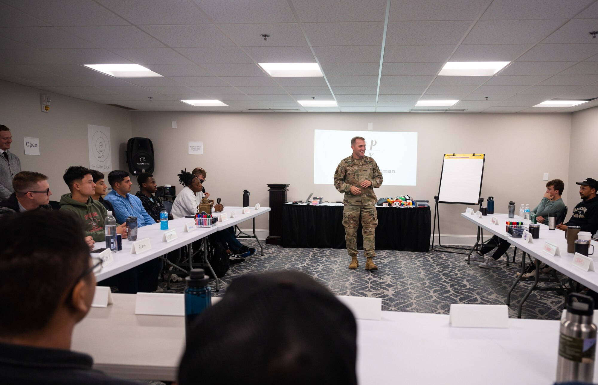 A commander speaks in a classroom