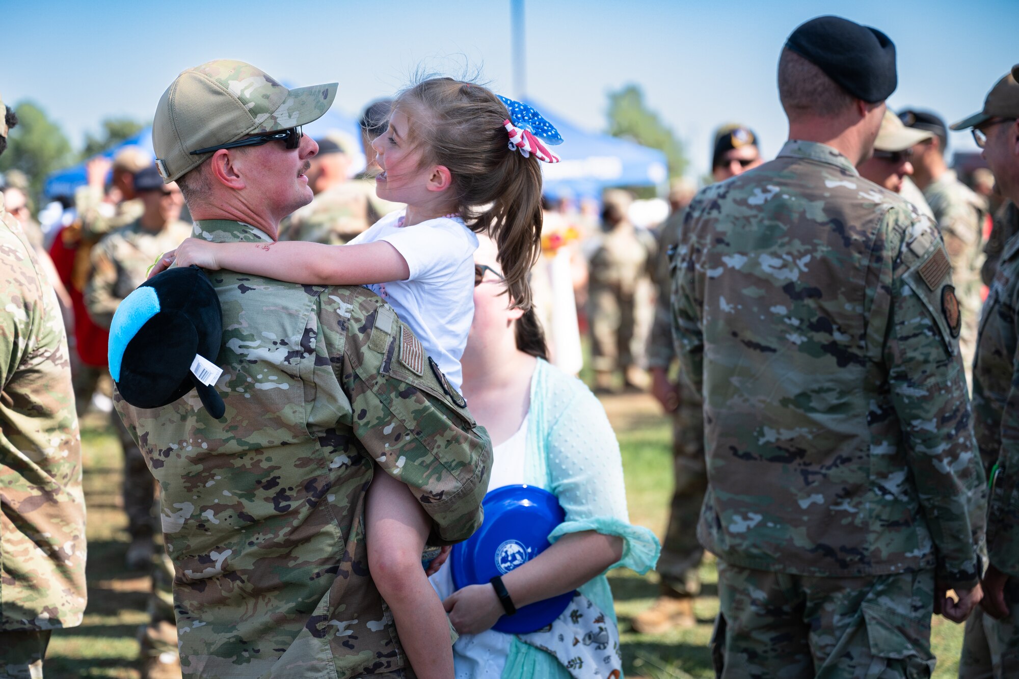Dyess Airmen and families welcome home deployed personnel at Dyess Air Force Base, Texas, Oct. 10, 2024. Returning personnel were greeted by their friends and families in a welcome home celebration. (U.S. Air Force photo by Airman 1st Class Jade M. Caldwell)