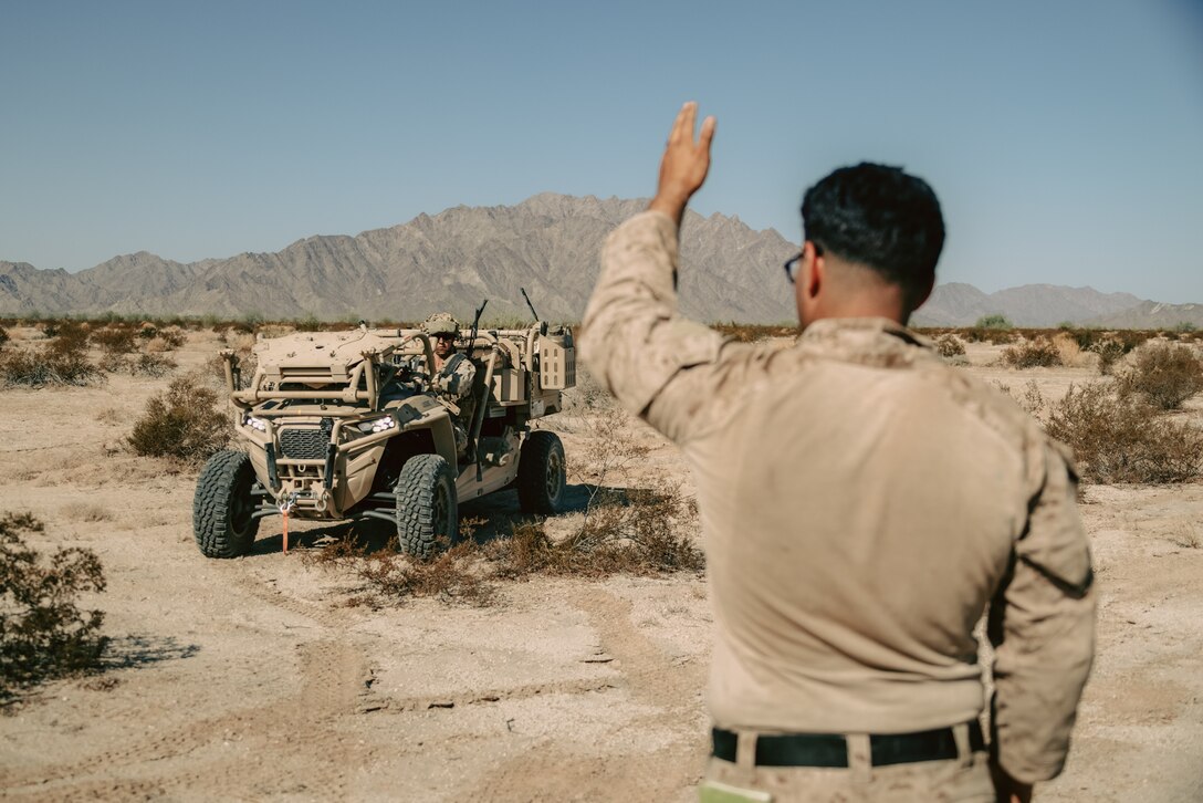 U.S. Marine Corps Sgt. Angel LopezLopez a Phoenix, Arizona native and a low altitude air defense gunner assigned to 3rd Low Altitude Air Defense Battalion, 3rd Marine Aircraft Wing, guides a Light Marine Air Defense Integrated System during a ground-based air defense exercise as part of Weapons and Tactics Instructor course 1-25 at Tacts Airfield near Wellton, Arizona, Oct. 10, 2024. WTI is a seven-week training event hosted by Marine Aviation Weapons and Tactics Squadron One which emphasizes operational integration of the six functions of Marine aviation in support of the Marine Air Ground Task Force, Joint and Coalition Forces. (U.S. Marine Corps photo by Lance Cpl. Micah Thompson)
