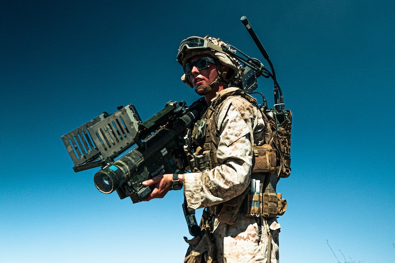 U.S. Marine Corps Lance Cpl. Brayden Westcott, a Midland, Texas native and a low altitude air defense gunner assigned to 3rd Low Altitude Air Defense Battalion, 3rd Marine Aircraft Wing, observes for simulated enemy aircraft during a ground-based air defense exercise as part of Weapons and Tactics Instructor course 1-25 at Tacts Airfield, near Wellton, Arizona, Oct. 10, 2024. WTI is a seven-week training event hosted by Marine Aviation Weapons and Tactics Squadron One which emphasizes operational integration of the six functions of Marine aviation in support of the Marine Air Ground Task Force, Joint and Coalition Forces. (U.S. Marine Corps photo by Cpl. Maurion Moore)