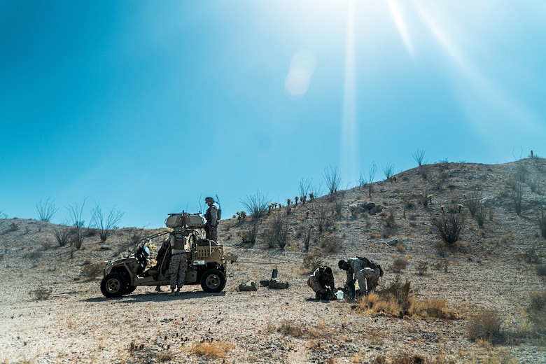 U.S. Marines assigned to Marine Aviation Weapons and Tactics Squadron One and 3rd Low Altitude Air Defense Battalion, 3rd Marine Aircraft Wing, participate in a ground-based air defense exercise as part of Weapons and Tactics Instructor course 1-25 at Tacts Airfield, near Wellton, Arizona, Oct. 10, 2024. WTI is a seven-week training event hosted by MAWTS-1 which emphasizes operational integration of the six functions of Marine aviation in support of the Marine Air Ground Task Force, Joint and Coalition Forces. (U.S. Marine Corps photo by Cpl. Maurion Moore)