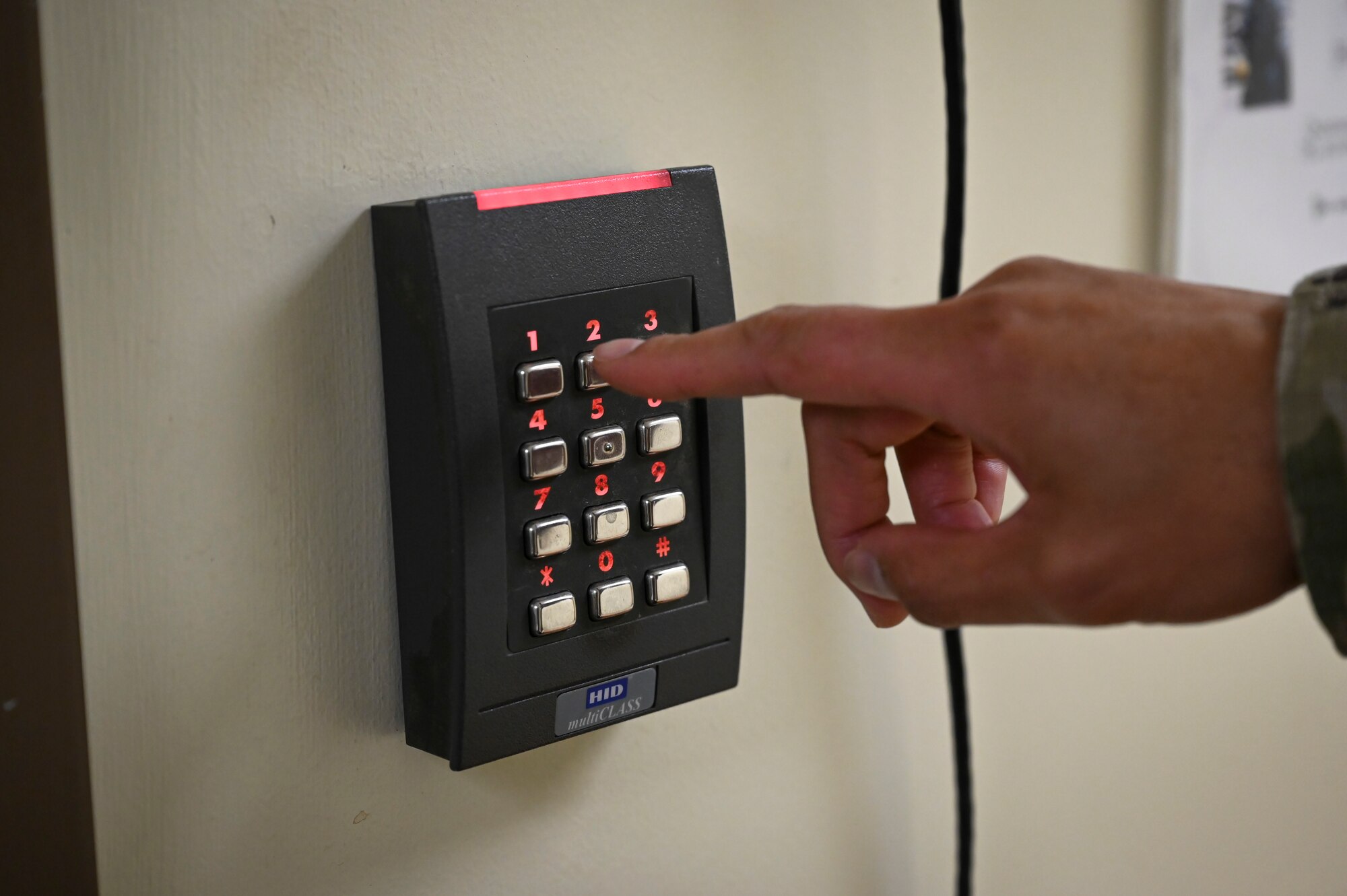 Tech. Sgt. Nikkie Javier, 8th Fighter Wing logistics manager, enters a code to go into the Advanced Programs Office.