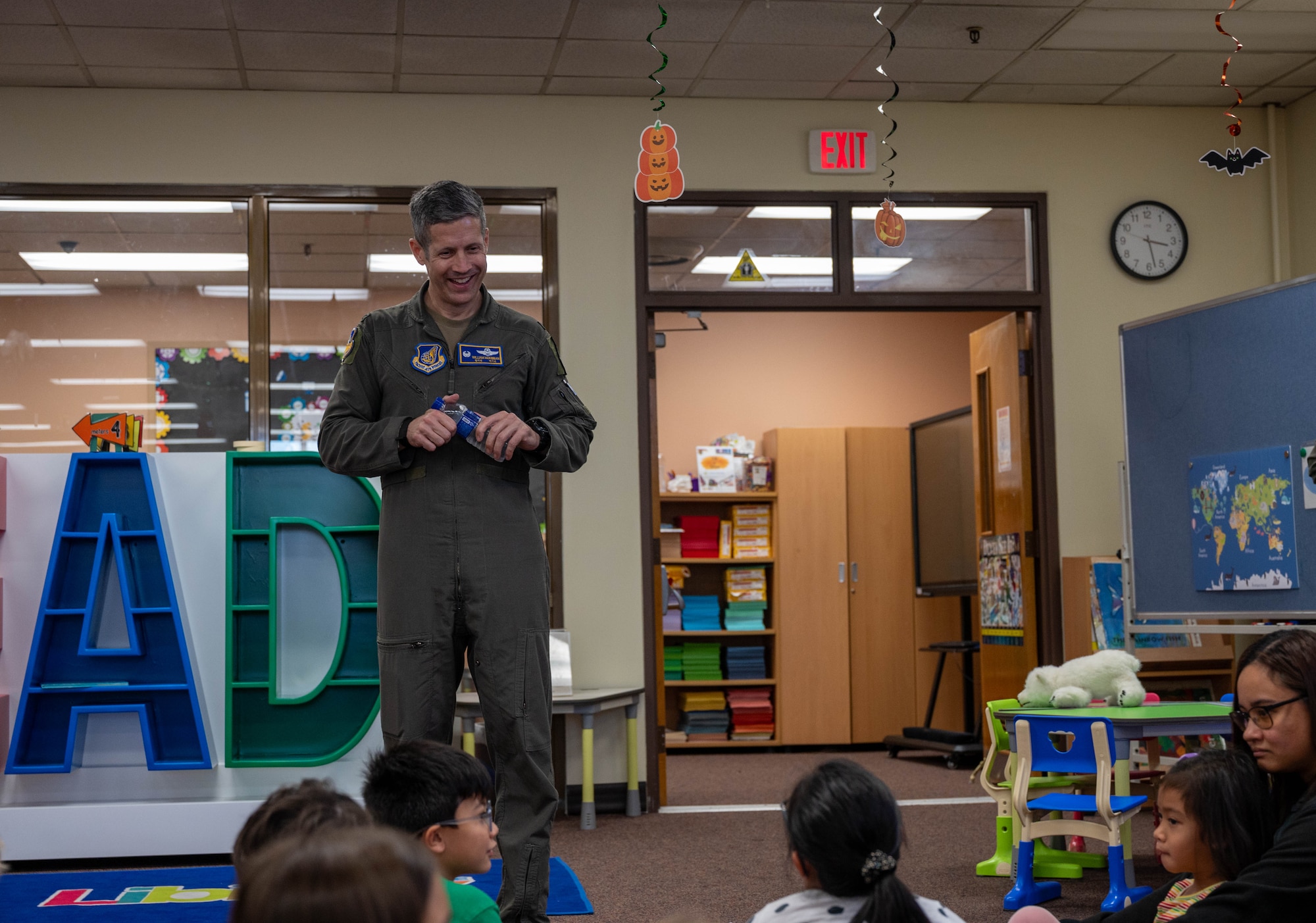U.S. Air Force Col. William McKibban, 51st Fighter Wing commander, speaks to children during an event at Osan Air Base, Republic of Korea, Oct. 15, 2024. Kids in aviation is an annual event for the children in the Osan community to learn more about aviation. (U.S. Air Force photo by Staff Sgt. Christopher Tam)