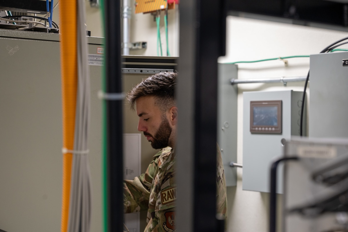 U.S. Air Force Senior Airman Talon Rivera, 39th Operations Support Squadron Radar, Airfield and Weather Systems journeyman, disconnects cables on the digital airport surveillance radar (DASR) tower ladder to verify signal readings, Oct. 10, 2024, at Incirlik Air Base, Türkiye