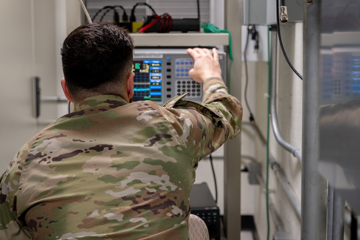 U.S. Air Force Senior Airman Talon Rivera, 39th Operations Support Squadron Radar, Airfield and Weather Systems journeyman calibrates a peak power analyzer to check radar signal strength, Oct. 10, 2024, at Incirlik Air Base, Türkiye