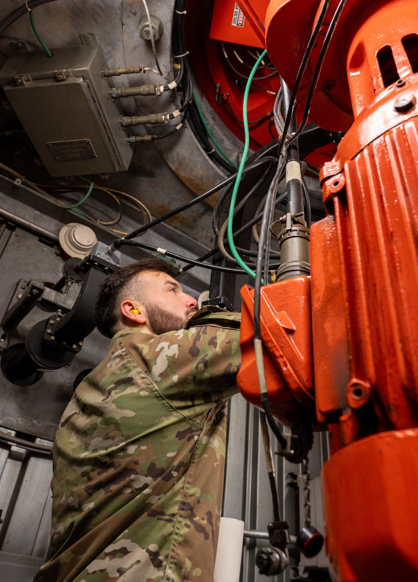 U.S. Air Force Senior Airman Talon Rivera, 39th Operations Support Squadron Radar, Airfield and Weather Systems journeyman, performs a visual inspection of the digital airport surveillance radar (DASR) rotary joint to check for leaks and corrosion, Oct. 10, 2024, at Incirlik Air Base, Türkiye