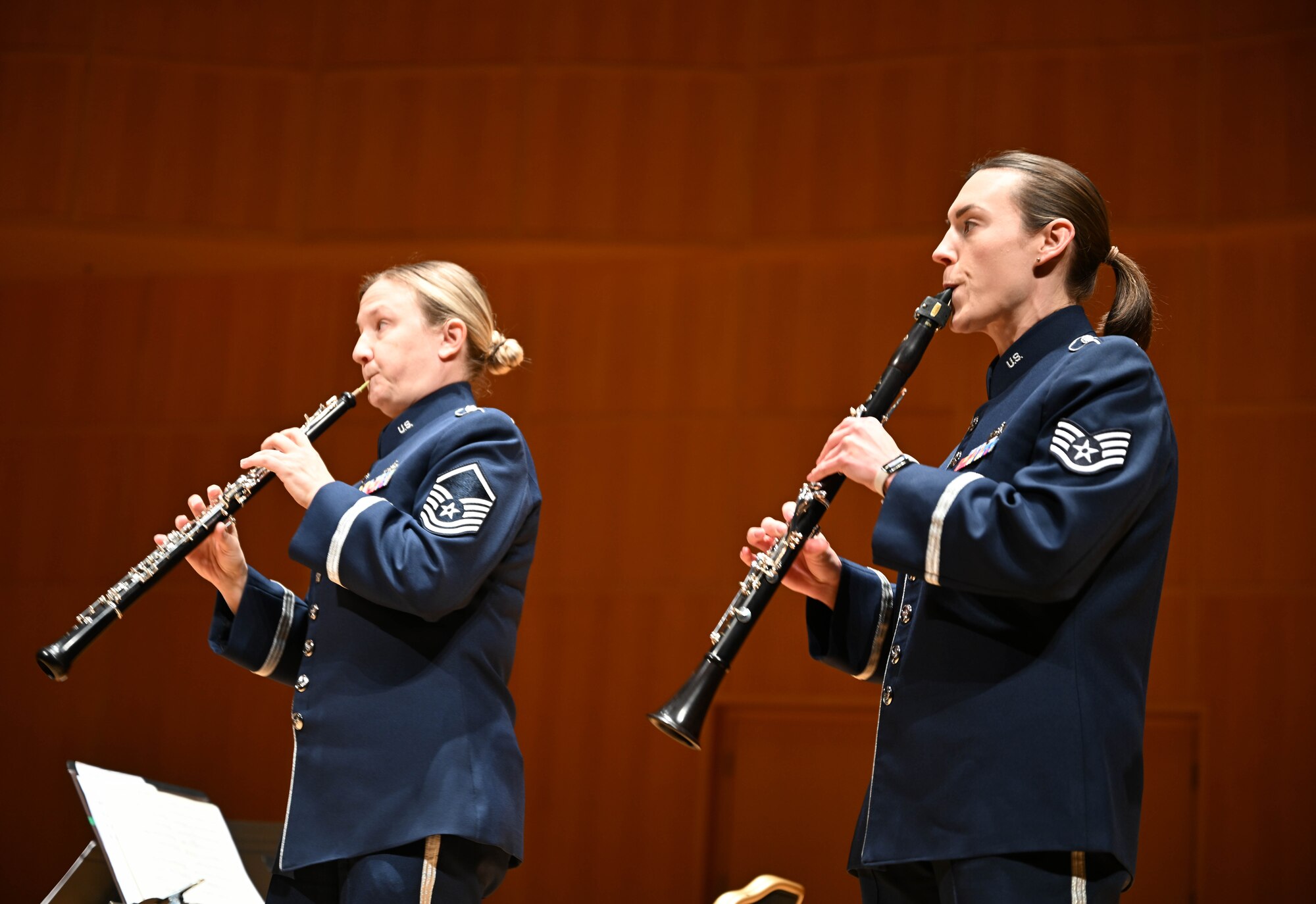 Master Sgt. Kelly Longmire and Staff Sgt. Hilary Zirkle, Heritage of America Band, Heritage Winds musicians, play their instruments during a public concert at the Ford Recital Hall, DeYor Performing Arts Center, Youngstown, Ohio, Oct. 15, 2024.