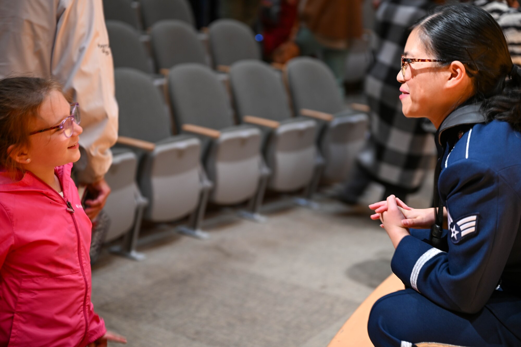 Senior Airman Debra Loh, Heritage of America Band, Heritage Winds musician, meets with a fan after a public concert at the Ford Recital Hall, DeYor Performing Arts Center, Youngstown, Ohio, Oct. 15, 2024.