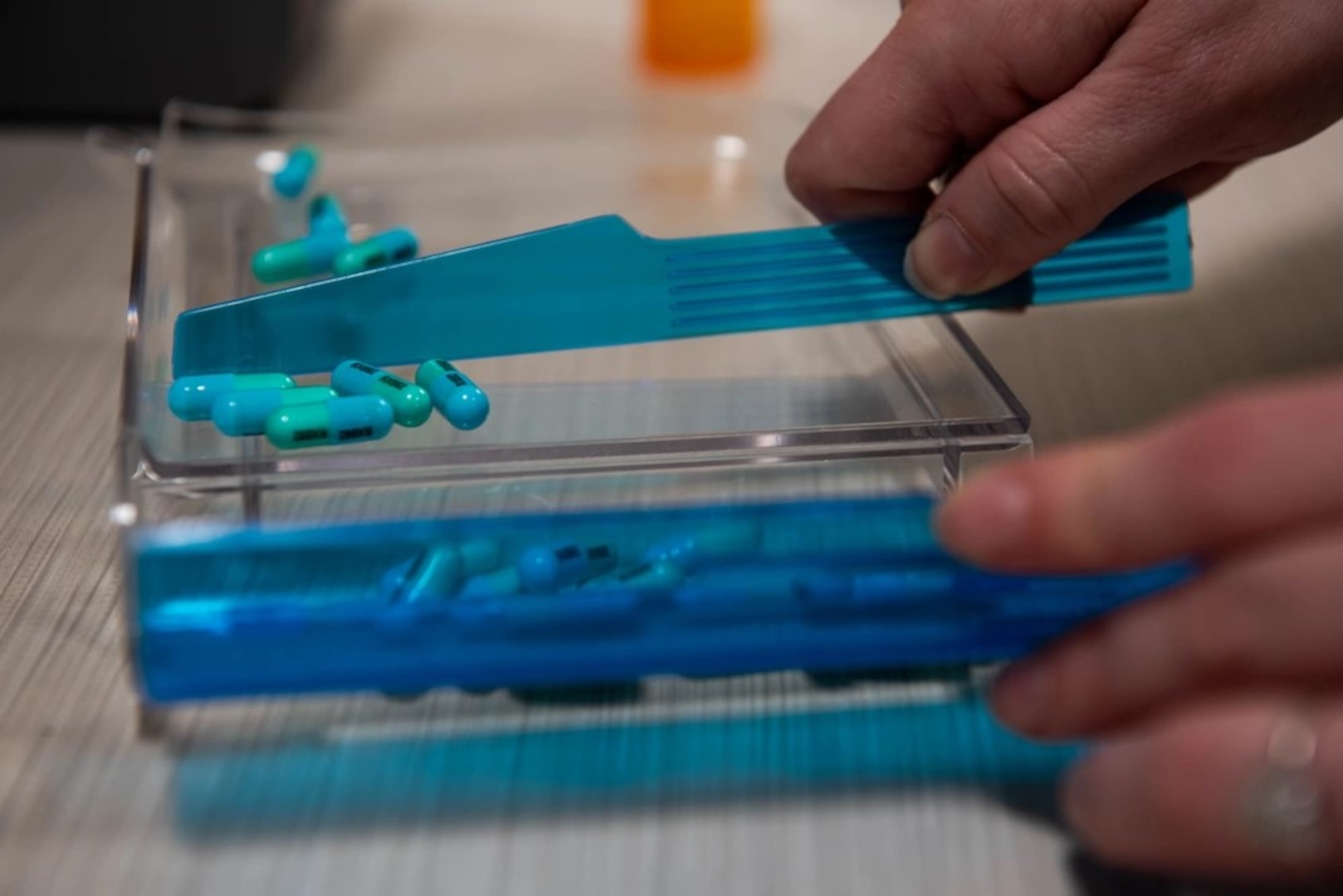 A U.S. Airman assigned to 60th Diagnostics and Therapeutics Squadron sorts through medicine for a patient’s prescription at the base pharmacy at Travis Air Force Base, California, Jan. 26, 2024. The pharmacy fills approximately 520,000 prescriptions per year to service members, their families and veterans. The Defense Logistics Agency Troop Support Medical supply chain and the Department of Veterans Affairs work together to negotiate better value on prescription drugs. This work includes procurement of pharmaceuticals for veterans, DOD beneficiaries and patients of other federal healthcare systems. Photo by Kenneth Abbate.