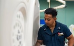 U.S. Navy Hospital Corpsman 1st Class Jed Rodrigues, from Los Angeles, prepares a patient for a Computerized Tomography (CT) scan aboard Military Sealift Command hospital ship USNS Mercy (T-AH 19) in support of Pacific Partnership 2022. The Defense Logistics Agency Medical supply chain and the Department of Veterans Affairs work together to procure acquire medical capital equipment .Photo by Mass Communication Specialist 3rd Class Raphael McCorey.