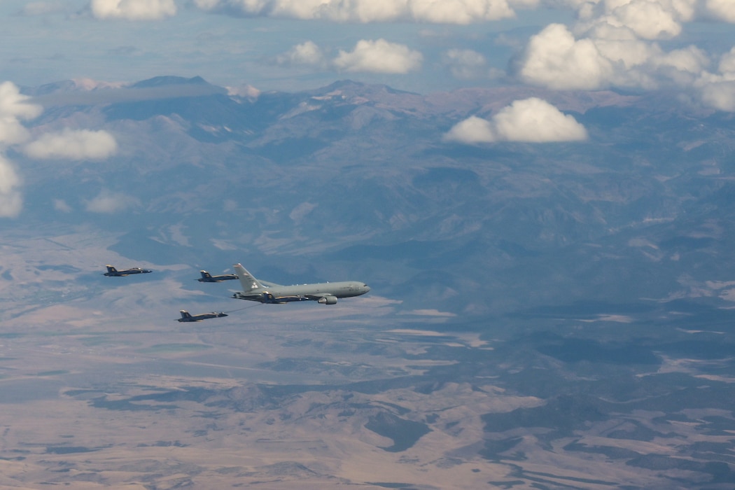 A KC-46 Pegasus aircraft refuels a U.S. Navy Blue Angels F/A-18 Super Hornet aircraft in the skies of Texoma, Oct. 14, 2024. After months of coordination, the 56th Air Refueling Squadron decided it was more efficient to have two tankers refuel the Blue Angels. (U.S. Air Force photo by Airman 1st Class Lauren Torres)