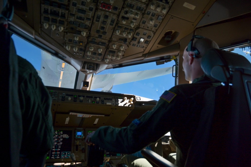 U.S. Air Force Major Brian Weeks, 56th Air Refueling Squadron KC-46 Pegasus aircraft formal training unit instructor pilot, performs aerial refueling (AR) with a second KC-46 in the skies of Oklahoma, Oct. 14, 2024. The pilots demonstrated AR for 19 Naval ROTC midshipmen from The University of Oklahoma. (U.S. Air Force photo by Airman 1st Class Lauren Torres)