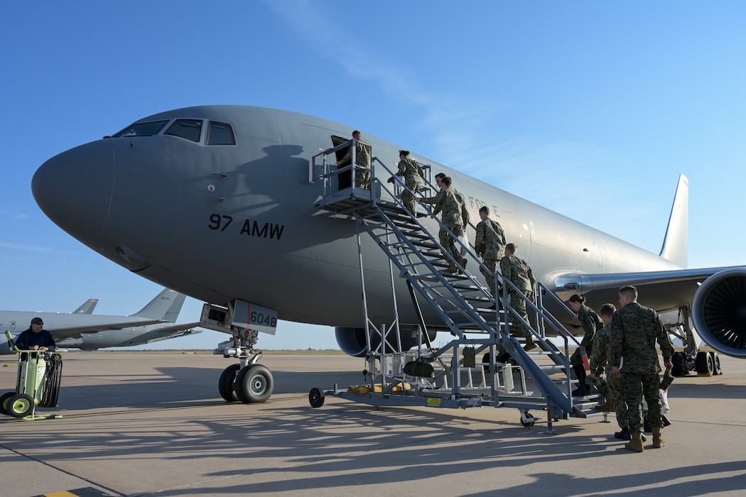 The University of Oklahoma Naval ROTC midshipmen and instructors board a KC-46 Pegasus aircraft at Altus Air Force Base, Oklahoma, Oct. 14, 2024. The group traveled from Oklahoma City to experience aerial refueling with the Mighty 97th. (U.S. Air Force photo by Airman 1st Class Lauren Torres)