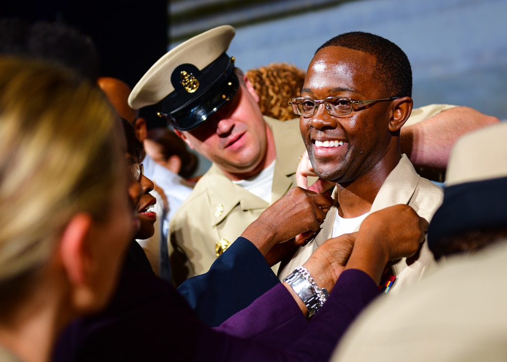 WASHINGTON (September 27, 2024) - A Chief select is officially pinned to the rank of Chief by family and mentors during a Chief Pinning Ceremony at the U.S. Navy Memorial. The rank of chief petty officer was created April 1, 1893, and the chief petty officer pinning ceremony is a unique tradition to the U.S. Navy that signifies promotion to a crucial position of leadership and responsibility. (U.S. Navy photo by Mass Communication Specialist 1st Class Griffin Kersting)