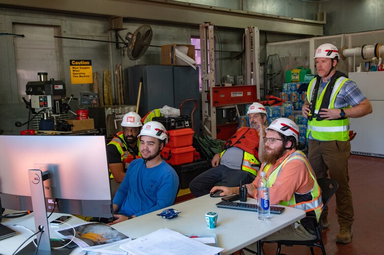 A team from the U.S. Army Corps of Engineers Engineer Research and Development Center (ERDC) controls the movements of a Remotely-Operated Vehicle (ROV) and monitors screens relaying data from the ROV back to them at Wilson Lock in Florence, Ala., Oct. 9, 2024. Teams from ERDC support USACE districts by providing technical assistance and capabilities exceeding the districts’ own, including the use of ROVs to examine underwater maintenance concerns at USACE-operated locks like Wilson.