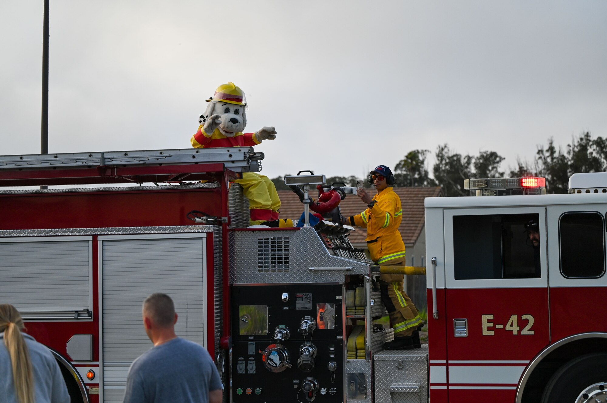 A firetruck drives down a street.