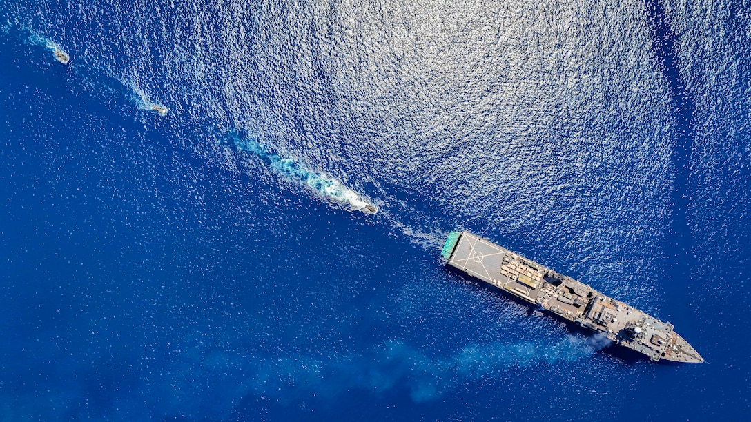 [240626-N-HV010-1011] Amphibious Combat Vehicles attached to Battalion Landing Team (BLT) 1/5, 15th Marine Expeditionary Unit, conduct amphibious operations with the amphibious dock landing ship USS Harpers Ferry (LSD 49) at White Beach Naval Facility, Okinawa, Japan, June 26, 2024. Harpers Ferry and embarked elements of the 15th MEU are conducting routine operations in the U.S. 7th Fleet area of operations. U.S. 7th Fleet is the U.S. Navy’s largest forward-deployed numbered fleet, and routinely interacts and operates with allies and partners in preserving a free and open Indo-Pacific region. (U.S. Navy photo by Mass Communication Specialist 2nd Class Sang Kim)
