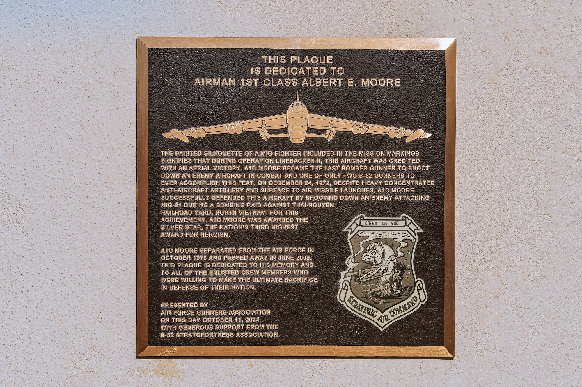 The Air Force Gunners Association (AFGA) dedicated a plaque in honor of Airman 1st Class Albert Moore, a Vietnam War hero and B-52 tail gunner during a ceremony at the U.S. Air Force Academy, Colo., Oct. 11, 2024. The ceremony paid tribute to Moore’s bravery during a Christmas Eve mission in 1972, where he played a crucial role in one of the few aerial victories by a B-52 Stratofortress. (U.S. Air Force photo by Dylan Smith)