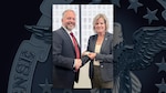The Defense Logistics Agency’s Deputy Director of Logistics Operations Kristin French, right, and the Deputy Assistant Secretary of State for Logistics Management Seth Green, left, signed a ten-year, $600 million interagency agreement Oct. 7, 2024