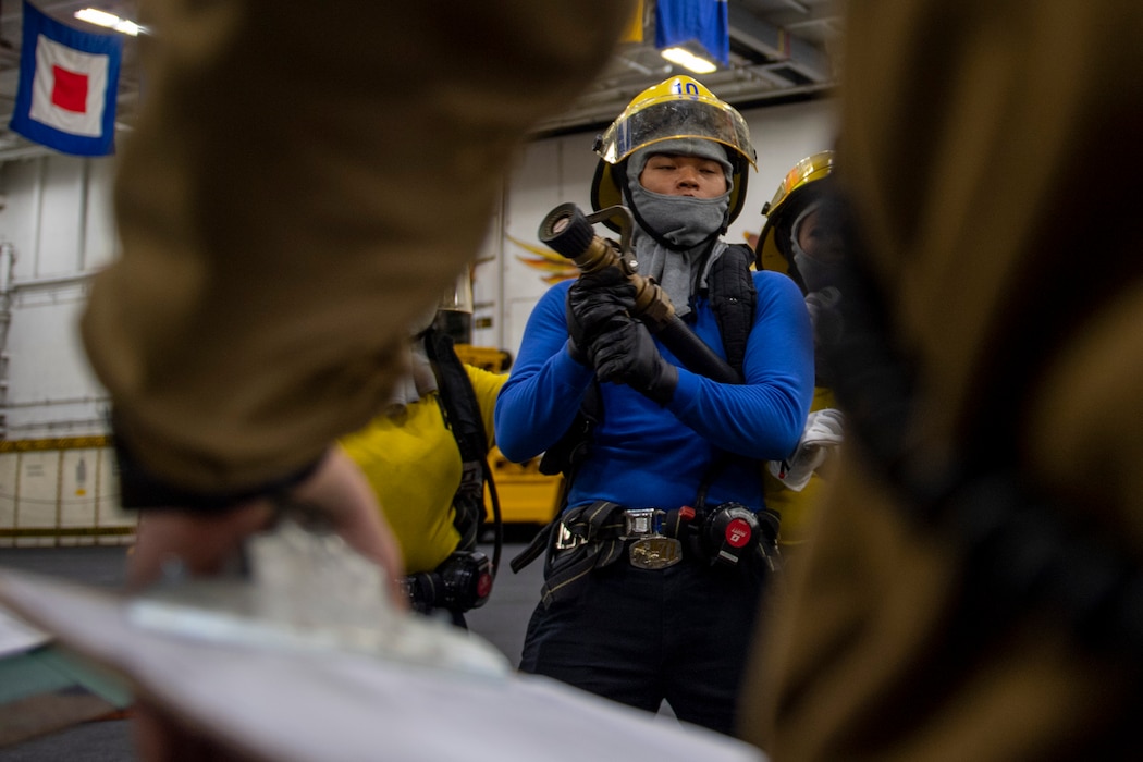 Sailors conduct general quarters training aboard USS Carl Vinson (CVN 70) in the Pacific Ocean.