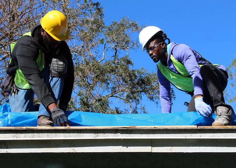 The U.S. Army Corps of Engineers (USACE) Operation Blue Roof Program contractors install first blue roof at a record-setting pace, one-week post-storm and one day after the issuance of the notice to proceed, in the wake of the aftermath of Hurricane Milton. (USACE photo by Peggy Bebb)