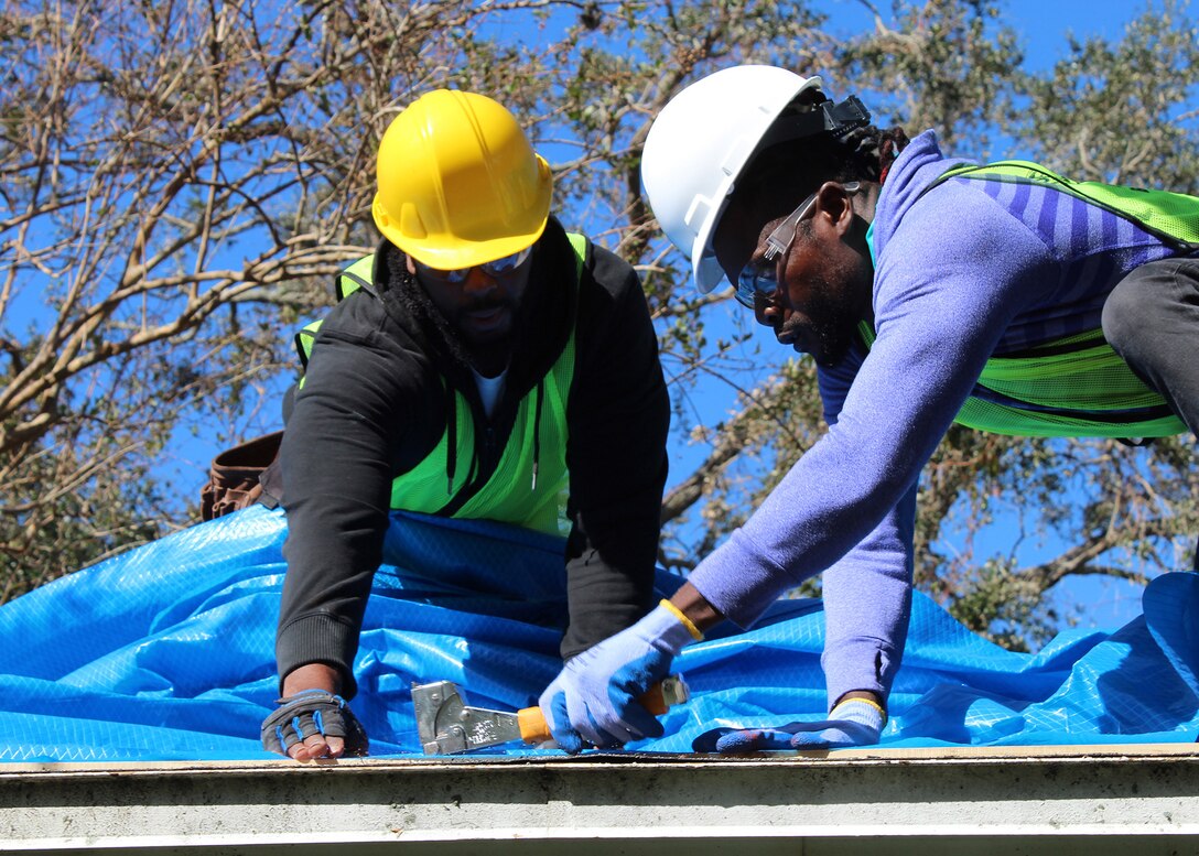 The U.S. Army Corps of Engineers (USACE) Operation Blue Roof Program contractors install first blue roof at a record-setting pace, one-week post-storm and one day after the issuance of the notice to proceed, in the wake of the aftermath of Hurricane Milton. (USACE photo by Peggy Bebb)
