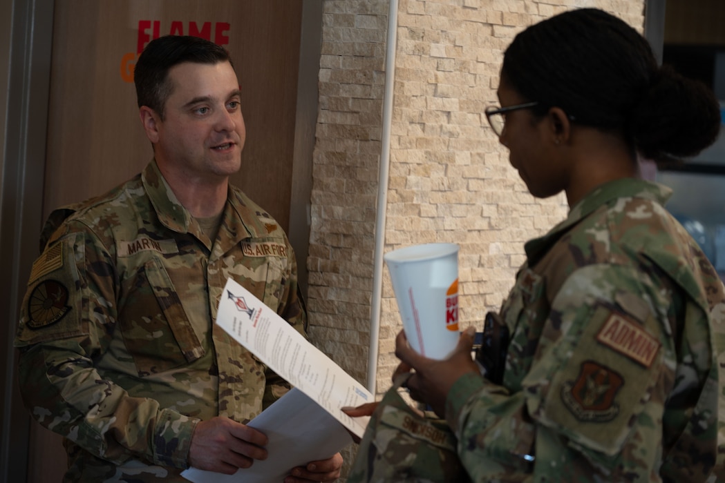 U.S. Air Force Master Sgt. Shawn Martin, left, 436th Force Support Squadron first sergeant, explains Operation Warm Heart to an Airman at Dover Air Force Base, Delaware, Oct. 16, 2024. The event was facilitated by Team Dover’s first sergeants, Operation Warm Heart is a nonprofit organization that is dedicated to providing emergency financial relief, morale building and quality of life enhancements to military members and their families stationed at Dover AFB. (U.S. Air Force Photo by Senior Airman Dieondiere Jefferies)