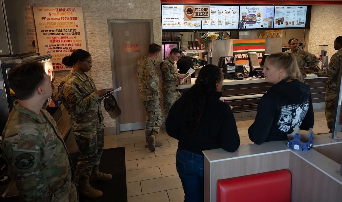 436th Airlift Wing members wait in a restaurant lobby during Operation Warm Heart at Dover Air Force Base, Delaware, Oct. 16, 2024. The event was facilitated by Team Dover’s first sergeants, Operation Warm Heart is a nonprofit organization that is dedicated to providing emergency financial relief, morale building and quality of life enhancements to military members and their families stationed at Dover AFB. (U.S. Air Force Photo by Senior Airman Dieondiere Jefferies)