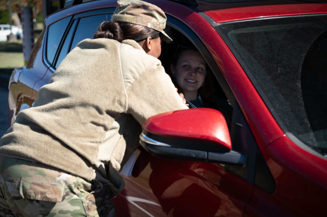 Master Sgt. Mercedes McCoy Garrett, 512th Memorial Affairs Squadron first sergeant, explains Operation Warm Heart to a Team Dover member at Dover Air Force Base, Delaware, Oct. 16, 2024. The event was facilitated by Team Dover’s first sergeants, Operation Warm Heart is a nonprofit organization that is dedicated to providing emergency financial relief, morale building and quality of life enhancements to military members and their families stationed at Dover AFB. (U.S. Air Force Photo by Senior Airman Dieondiere Jefferies)