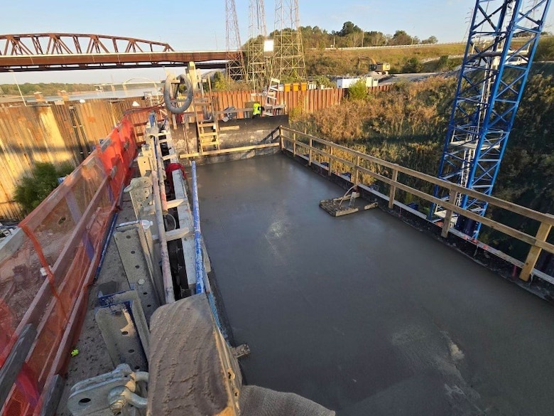 View of the first monolith “top-out” on the Kentucky Lock Addition Project located in Grand Rivers, KY, Oct. 12, 2024. A monolith is a single structure of concrete that is in the shape of a column. There are a total of 50 monoliths that are to be constructed made from five-foot layers of concrete. Each five-foot layer is called a lift. Early Saturday morning, the final concrete lift was completed for a monolith located on the downstream side of the lock being constructed.