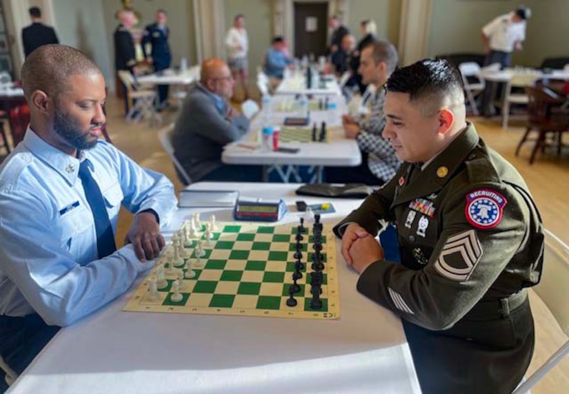 U.S. Army Soldier SFC Arellano sits at chess board during U.S. Armed Forces Chess Competition