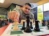 U.S. Army Soldier in uniform executes chess move