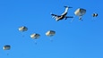 U.S. Army soldiers assigned to 2nd Infantry Brigade Combat Team (Airborne), 11th Airborne Division, descend from the sky onto Malamute Drop Zone on Joint Base Elmendorf-Richardson, Alaska for Arctic Aloha Oct. 15, 2024. Arctic Aloha, conducted alongside airmen and flight crews from the Air Force’s 15th, 62nd and 154th Wings, features airborne operations into two drop zones in Hawaii and Alaska, is a chance to increase interoperability while projecting a combat credible force, and gives 2nd Infantry Brigade Combat Team (Airborne) paratroopers experience jumping into varied terrain, all key capabilities in support of a free and open Indo-Pacific (U.S. Army B-Roll by Spc. Brandon Vasquez)