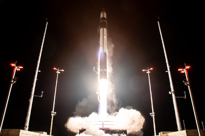 A rocket launches from a launchpad.