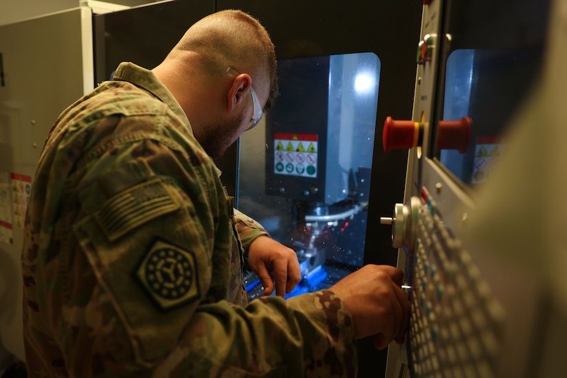 U.S. Army Staff Sgt. Allen Kemper, ARCENT Innovation and Manufacturing Center (AIM-C) NCOIC, welds metal pipes at the AIM-C in the U.S. Central Command area of responsibility.