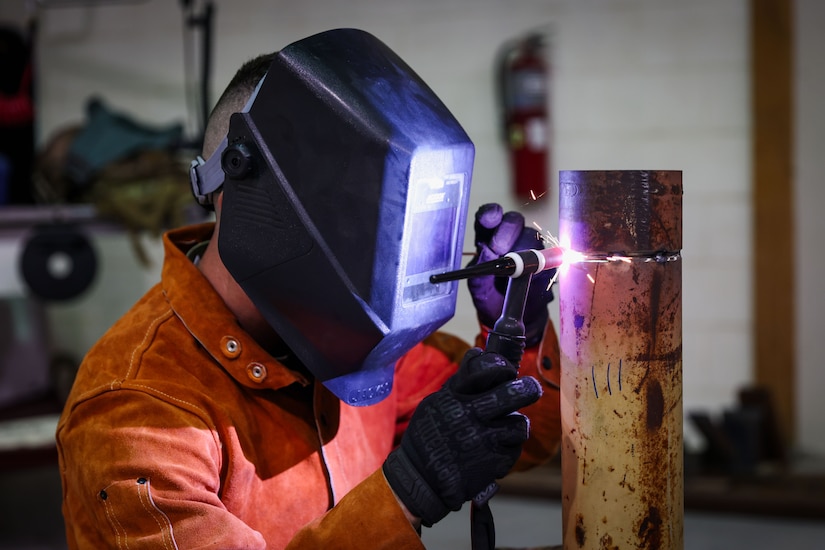 U.S. Army Staff Sgt. Allen Kemper, ARCENT Innovation and Manufacturing Center (AIM-C) NCOIC, welds metal pipes at the AIM-C in the U.S. Central Command area of responsibility.