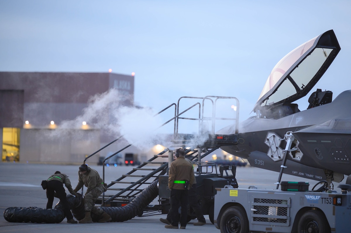 Airmen prepare an F-35A aircraft for takeoff.