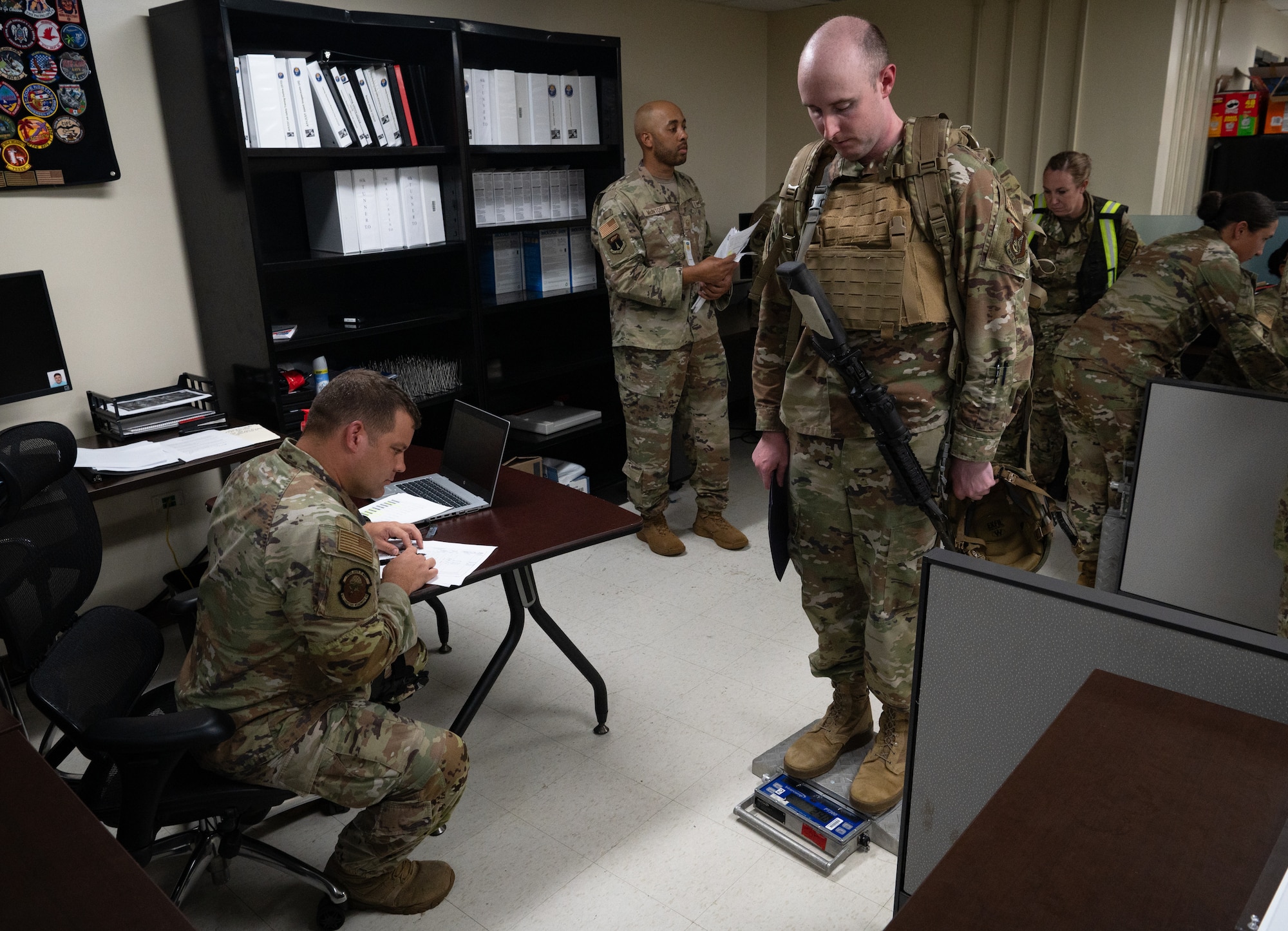 The 36th Wing participates in a simulated Personnel Deployment Function Line for Exercise Slingstone 24-4 at Andersen Air Force Base, Guam, October 18, 2024. A PDF Line is a comprehensive process involving multiple support agencies taking care of Airmen who are about to deploy. During Slingstone 24-4, Andersen tested this process and logged what is done efficiently and what could be improved should a real-world scenario happen. (U.S. Air Force Photo by Staff Sgt. Pedro Tenorio)
