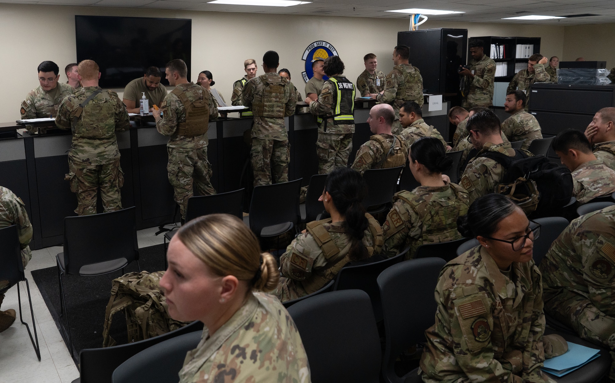 The 36th Wing participates in a simulated Personnel Deployment Function Line for Exercise Slingstone 24-4 at Andersen Air Force Base, Guam, October 18, 2024. A PDF Line is a comprehensive process involving multiple support agencies taking care of Airmen who are about to deploy. During Slingstone 24-4, Andersen tested this process and logged what is done efficiently and what could be improved should a real-world scenario happen. (U.S. Air Force Photo by Staff Sgt. Pedro Tenorio)
