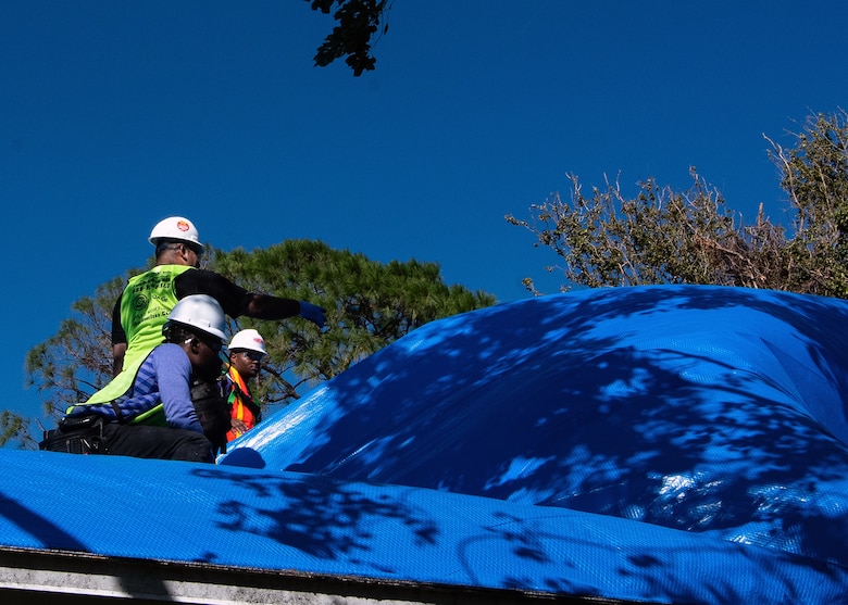 The U.S. Army Corps of Engineers (USACE) Operation Blue Roof Program contractors install first blue roof at a record-setting pace, one-week post-storm and one day after the issuance of the notice to proceed, in the wake of the aftermath of Hurricane Milton. (USACE Photo by Bri Sanchez)