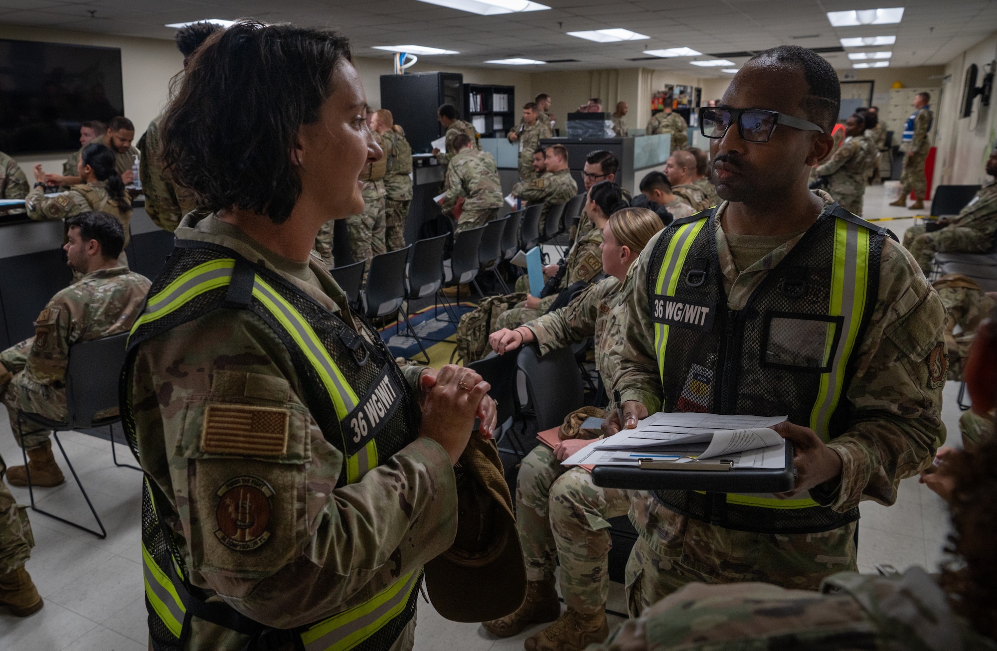 The 36th Wing participates in a simulated Personnel Deployment Function Line for Exercise Slingstone 24-4 at Andersen Air Force Base, Guam, October 18, 2024. A PDF Line is a comprehensive process involving multiple support agencies taking care of Airmen who are about to deploy. During Slingstone 24-4, Andersen tested this process and logged what is done efficiently and what could be improved should a real-world scenario happen. (U.S. Air Force Photo by Staff Sgt. Pedro Tenorio)
