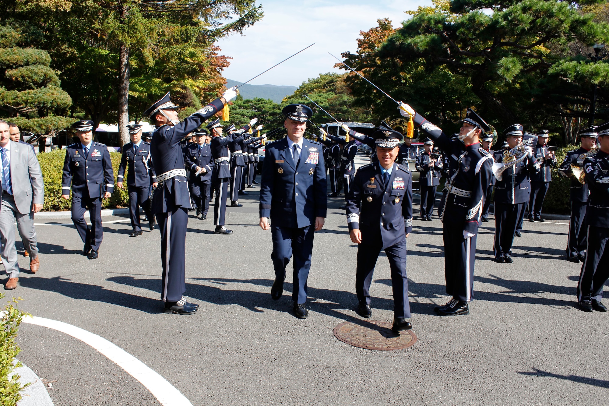 Chief of Staff of the Air Force Gen. David Allvin is welcomed by Gen. Lee Young-su, Republic of Korea Air Force Chief of Staff, as they walk through a saber arch in Gyeryongdae, South Korea, Oct. 17, 2024.